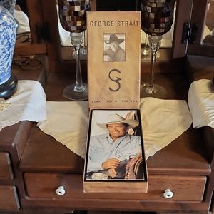 George Strait "straight out of the box" four c d's.